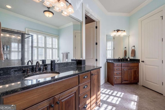 bathroom featuring vanity, crown molding, and walk in shower