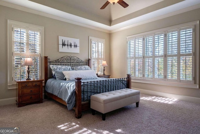 carpeted bedroom featuring multiple windows, ornamental molding, and ceiling fan