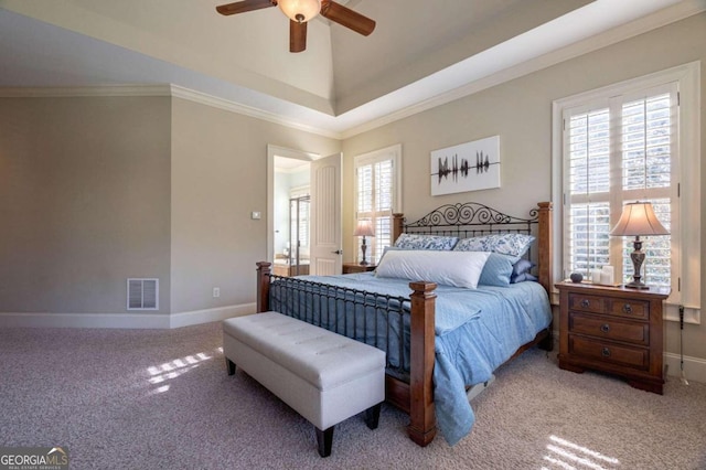 carpeted bedroom featuring ceiling fan and ornamental molding