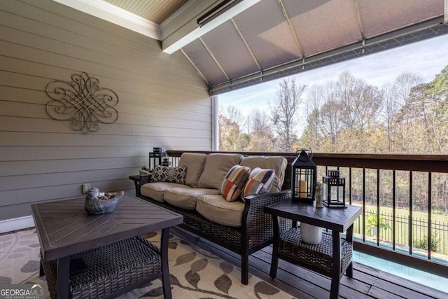 wooden deck featuring an outdoor hangout area