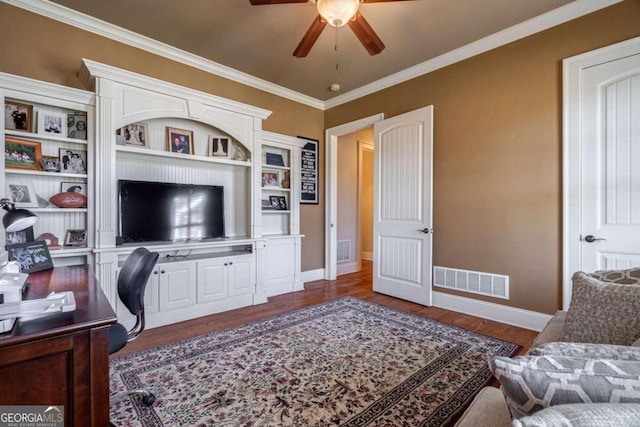 office area featuring ceiling fan, dark wood-type flooring, and ornamental molding