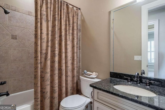 full bathroom featuring vanity, shower / bath combo, and toilet