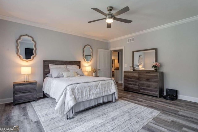 bedroom featuring hardwood / wood-style flooring, ceiling fan, and crown molding