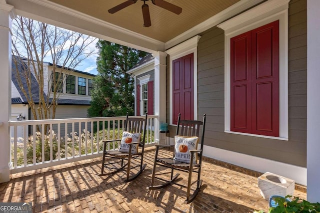 view of patio with ceiling fan and a porch