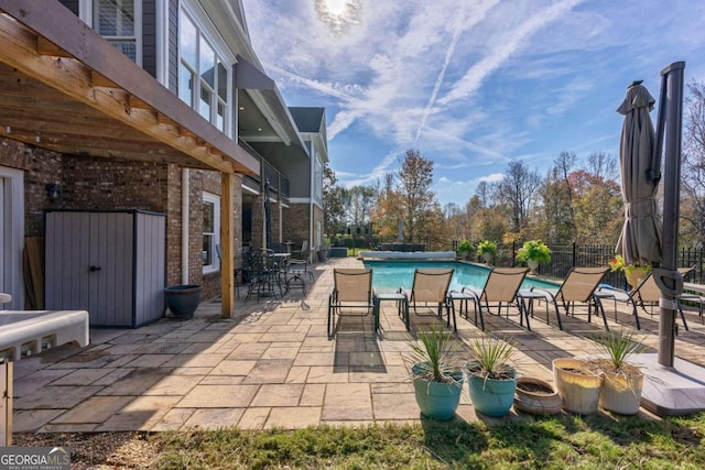 view of patio with a fenced in pool