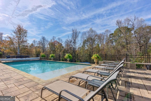 view of pool featuring a patio area