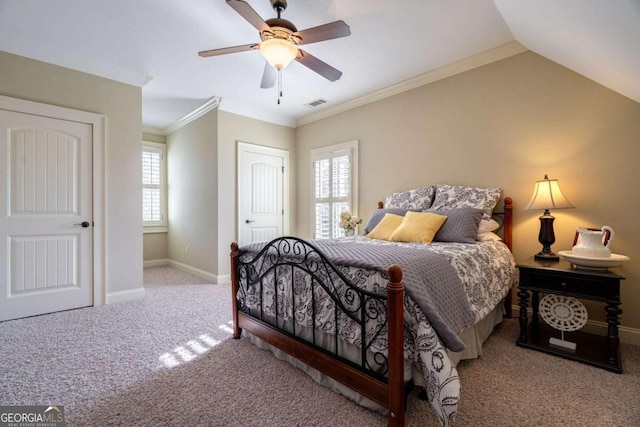 bedroom with light carpet, vaulted ceiling, ceiling fan, and ornamental molding