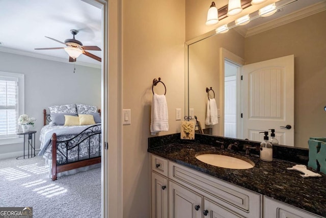 bathroom with ceiling fan, vanity, and ornamental molding