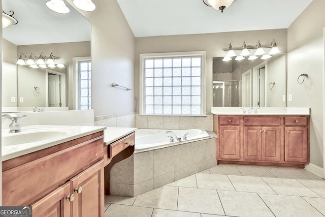 bathroom featuring tile patterned floors, vanity, and independent shower and bath