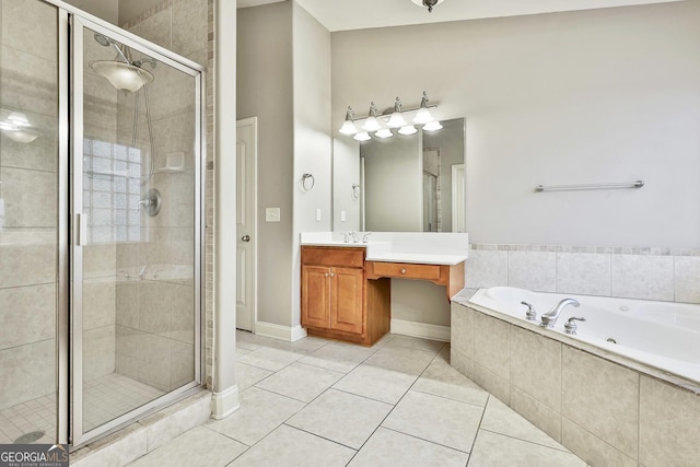 bathroom with tile patterned floors, vanity, and shower with separate bathtub