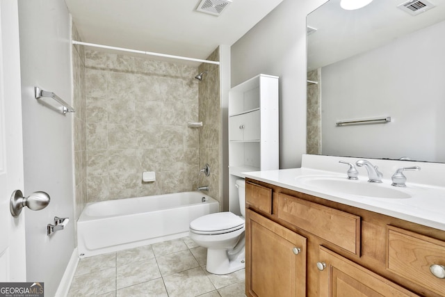 full bathroom featuring tile patterned floors, vanity, tiled shower / bath combo, and toilet