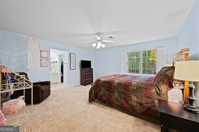 carpeted bedroom with connected bathroom and ceiling fan