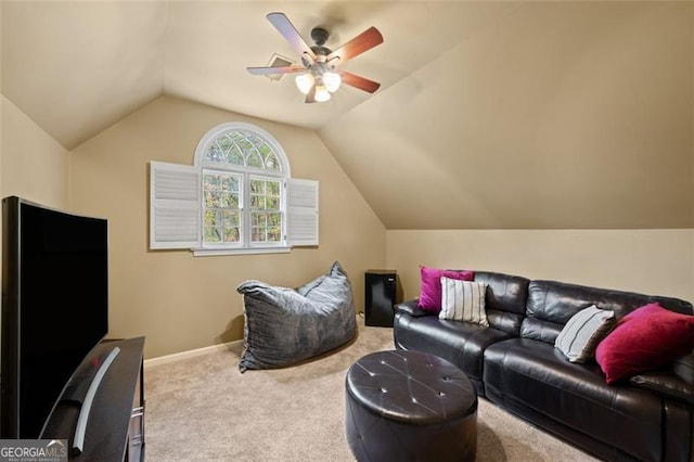 carpeted living room featuring ceiling fan and lofted ceiling