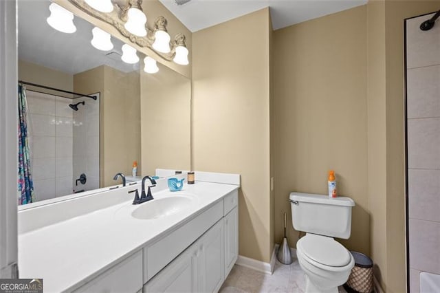 bathroom with vanity, curtained shower, and toilet