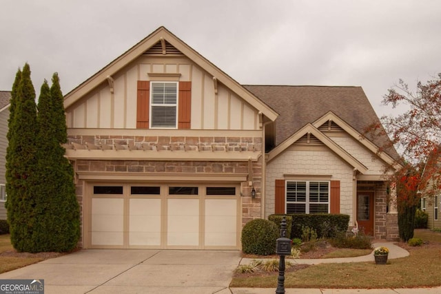 view of front of house with a garage, stone siding, board and batten siding, and concrete driveway