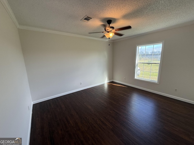 empty room with a textured ceiling, dark hardwood / wood-style flooring, ceiling fan, and crown molding