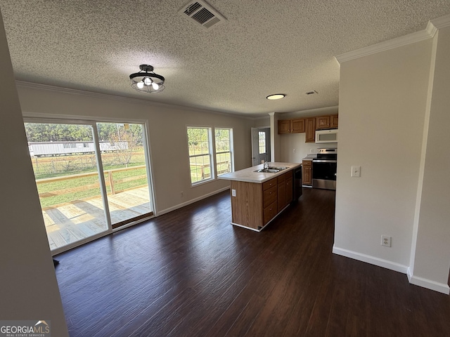 kitchen featuring sink, dishwasher, range, dark hardwood / wood-style floors, and a kitchen island