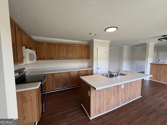 kitchen featuring sink, range with electric cooktop, crown molding, an island with sink, and dark hardwood / wood-style flooring