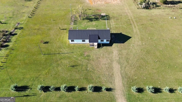 birds eye view of property featuring a rural view