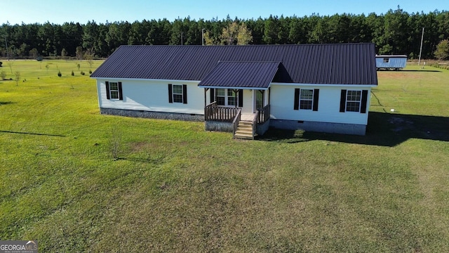 view of front of property with covered porch and a front yard