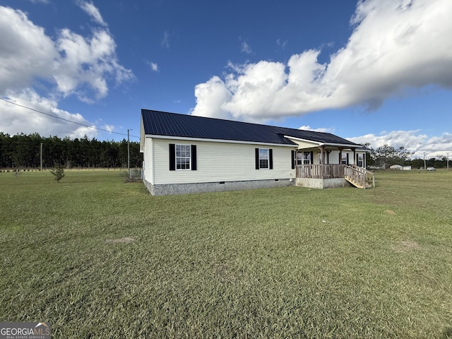 view of front of property with covered porch and a front yard