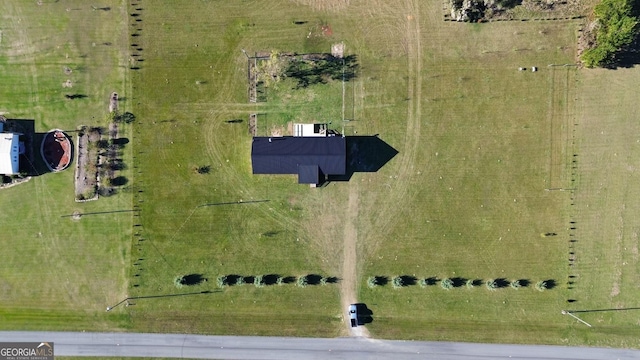 birds eye view of property featuring a rural view