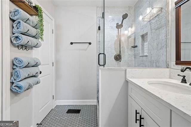 bathroom with vanity, tile patterned floors, and a shower with shower door