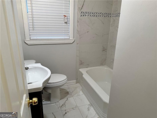 full bathroom with vanity, toilet, and tiled shower / bath