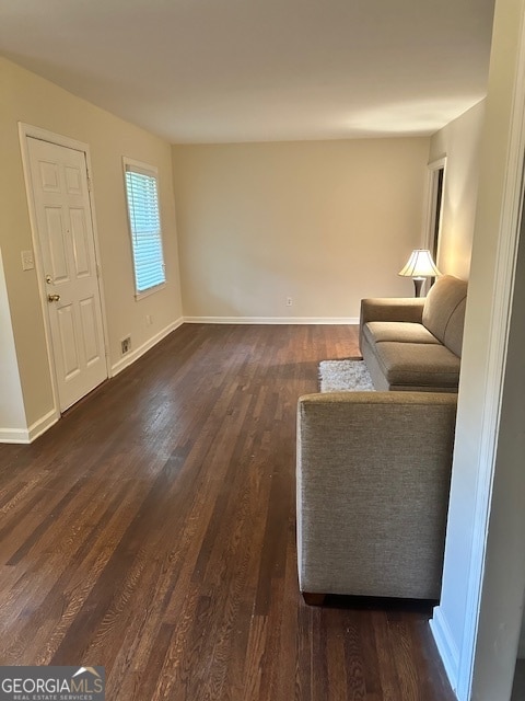 unfurnished living room featuring dark hardwood / wood-style flooring