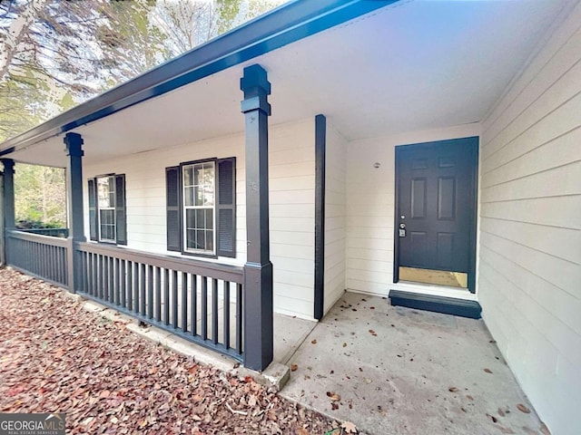 property entrance featuring covered porch