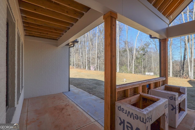 view of patio / terrace with a view of trees