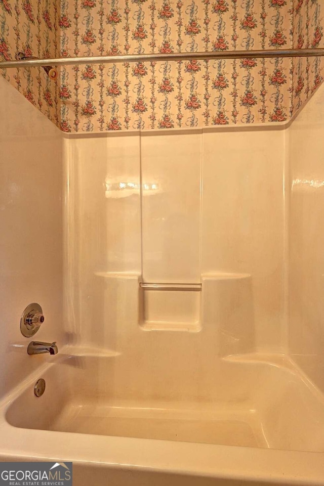 bathroom with shower / tub combination