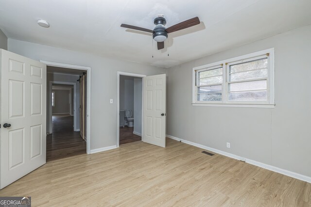 unfurnished bedroom featuring light hardwood / wood-style flooring and ceiling fan