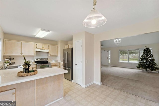 kitchen featuring light carpet, appliances with stainless steel finishes, light brown cabinetry, sink, and pendant lighting