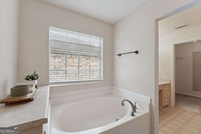 bathroom featuring vanity and a bathtub