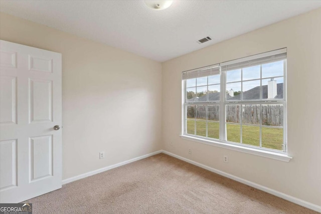 view of carpeted spare room