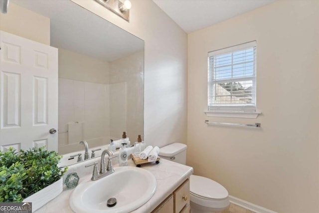 bathroom featuring vanity and toilet