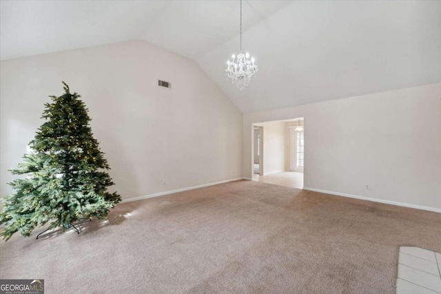 additional living space with a chandelier, light colored carpet, and vaulted ceiling