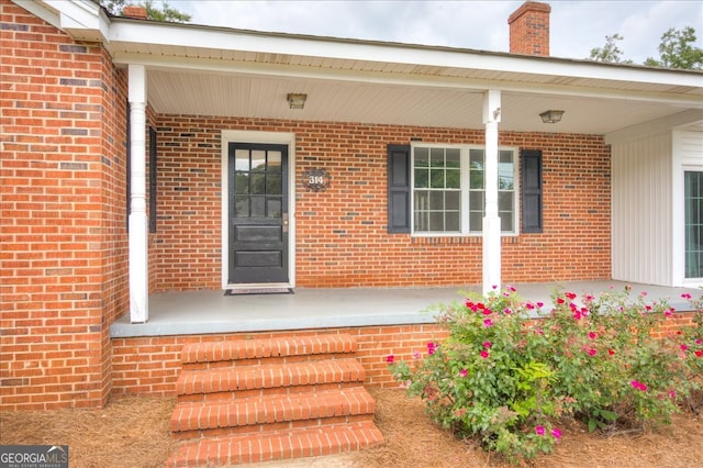 doorway to property featuring a porch