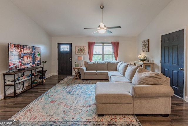 living room featuring dark wood-type flooring, ceiling fan, and lofted ceiling