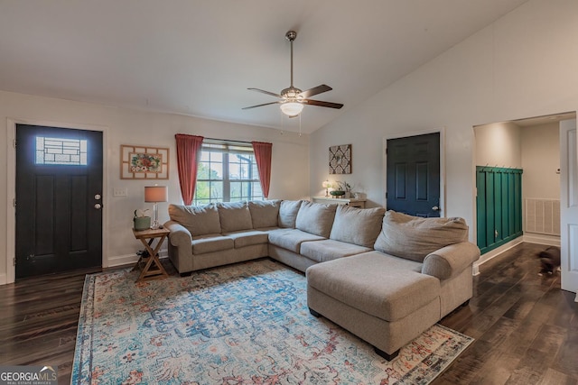 living room with dark wood-type flooring, ceiling fan, and high vaulted ceiling