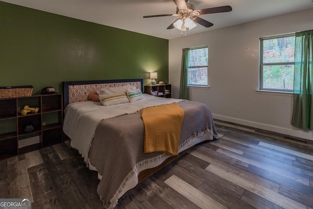 bedroom featuring ceiling fan and dark hardwood / wood-style flooring