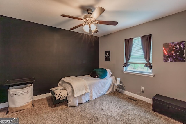 bedroom with ceiling fan and carpet flooring