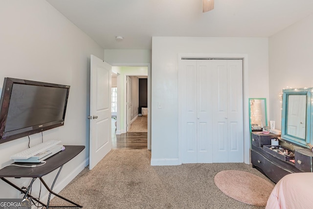 carpeted bedroom with a closet