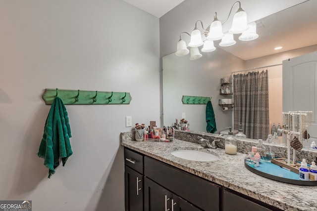 bathroom with vanity and a shower with shower curtain