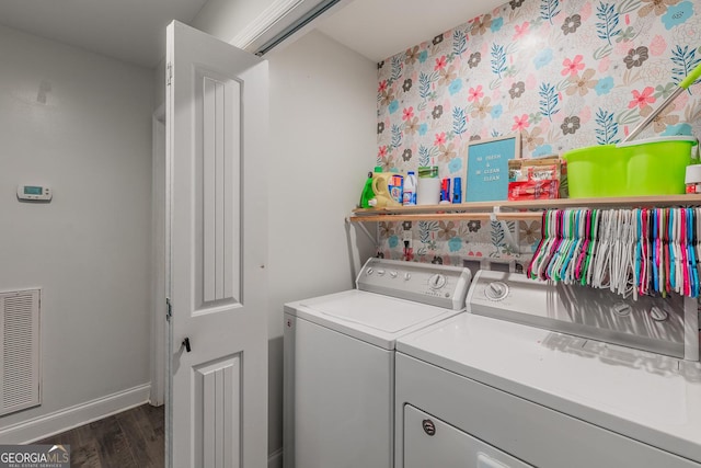 laundry room featuring separate washer and dryer and dark hardwood / wood-style floors