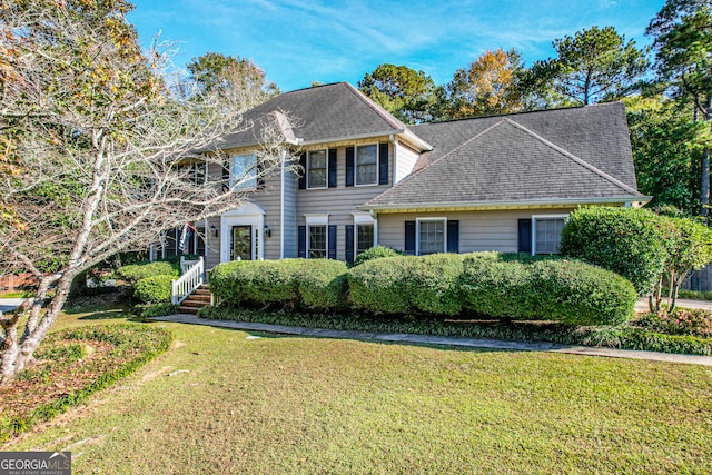 colonial inspired home with a front yard