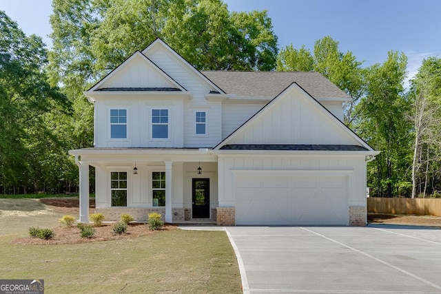 2198 Old Swimming Pool Rd, Jefferson, GA 30549 - view of front of property featuring an attached garage, a shingled roof, driveway, and board and batten siding