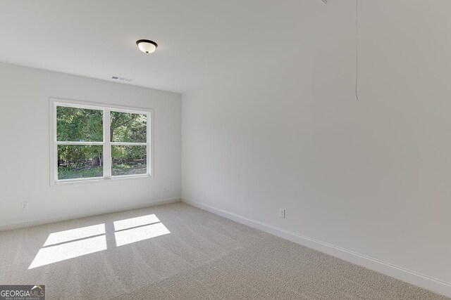 2198 Old Swimming Pool Rd, Jefferson, GA 30549 - spare room with light carpet, visible vents, and baseboards