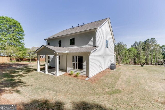 2198 Old Swimming Pool Rd, Jefferson, GA 30549 - back of property with a yard, central AC, a shingled roof, and a patio